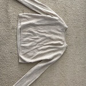 A Brandy Melville tan sweater! Super cute, comfy, and versatile!